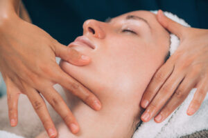 massaging face for facial fitness